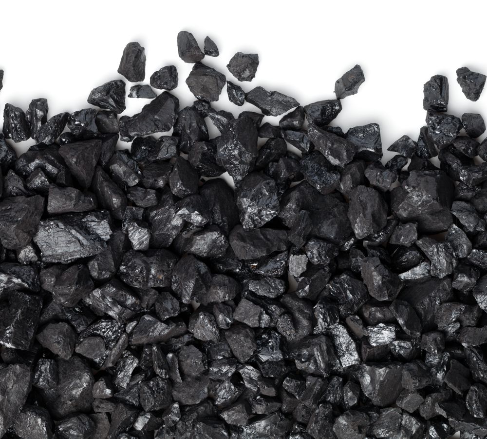 Black coal isolated on white background. Pea coal. Copy space, top view, flat lay